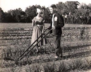 Black and white picture of youth in a field. 