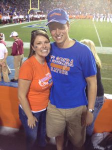 Megan stands with her (now) husband at Ben Hill Griffin Stadium.