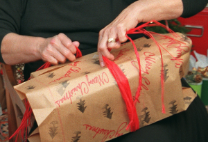 woman wrapping a gift