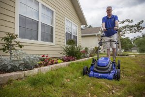 a man mowing a lawn
