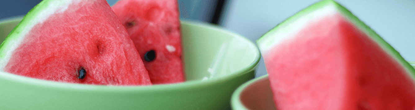 Watermelon slices in bowls.