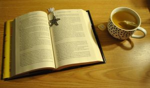 open book and cup of tea