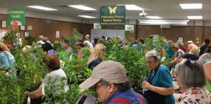 Master Gardener Volunteer Plant Sale showing people purchasing plants
