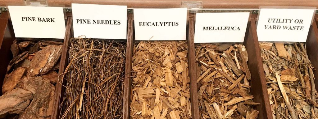 Box with samples of various types of mulch