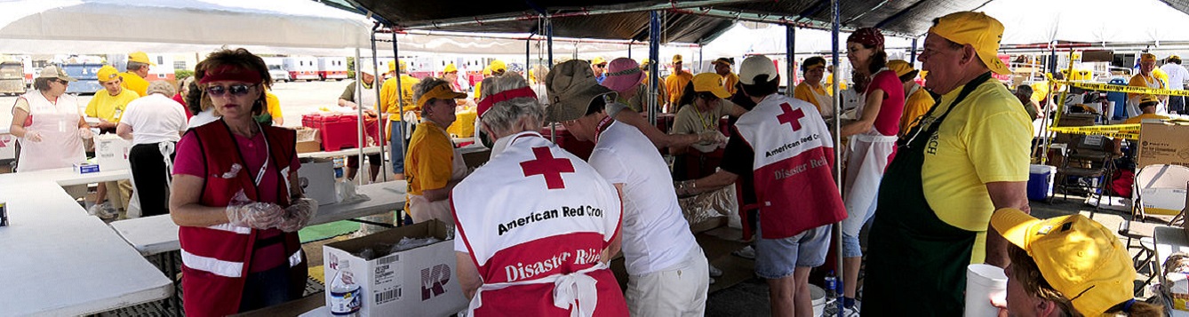 Volunteers prepare meals for storm survivors
