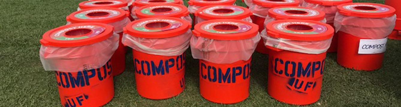 an array of compost bins waits at a rowing event