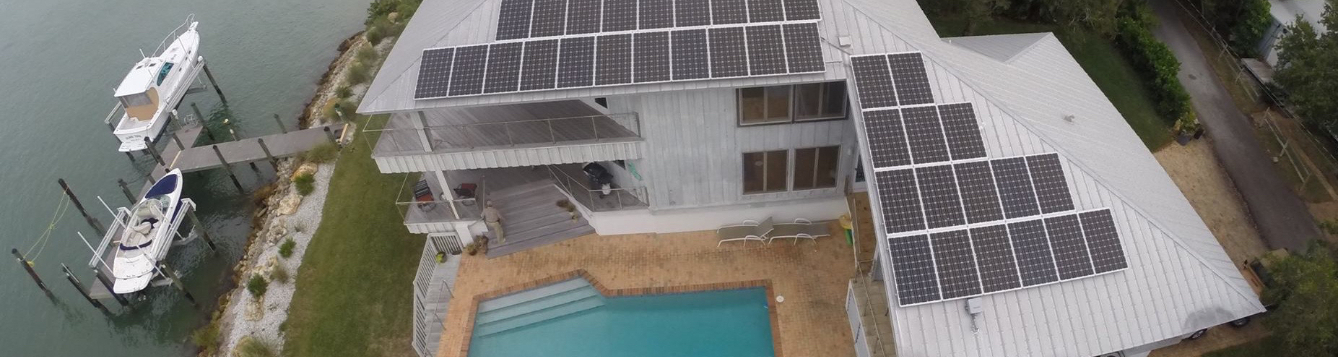 Aerial photo of Larry's home with solar panels attached to the roof