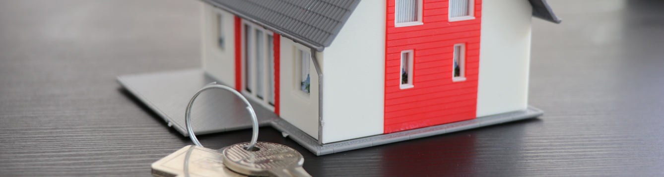 illustration featuring model/toy home with oversized keys alongside