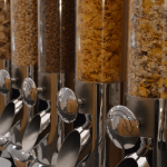 An array of cereals in a lineup of dispensers. [CREDIT, Werner Moser, pixabay.com]