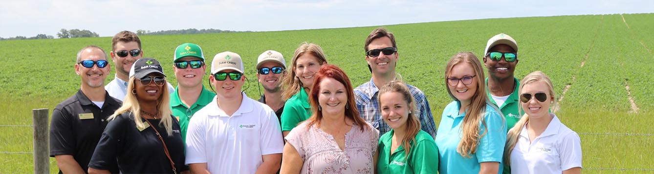 Farm Credit of Florida interns standing in farm field
