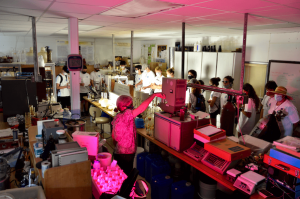 Students in a lab with red lights