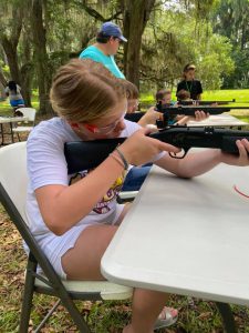 Taylor 4H youth learning how to shoot an air-soft gun