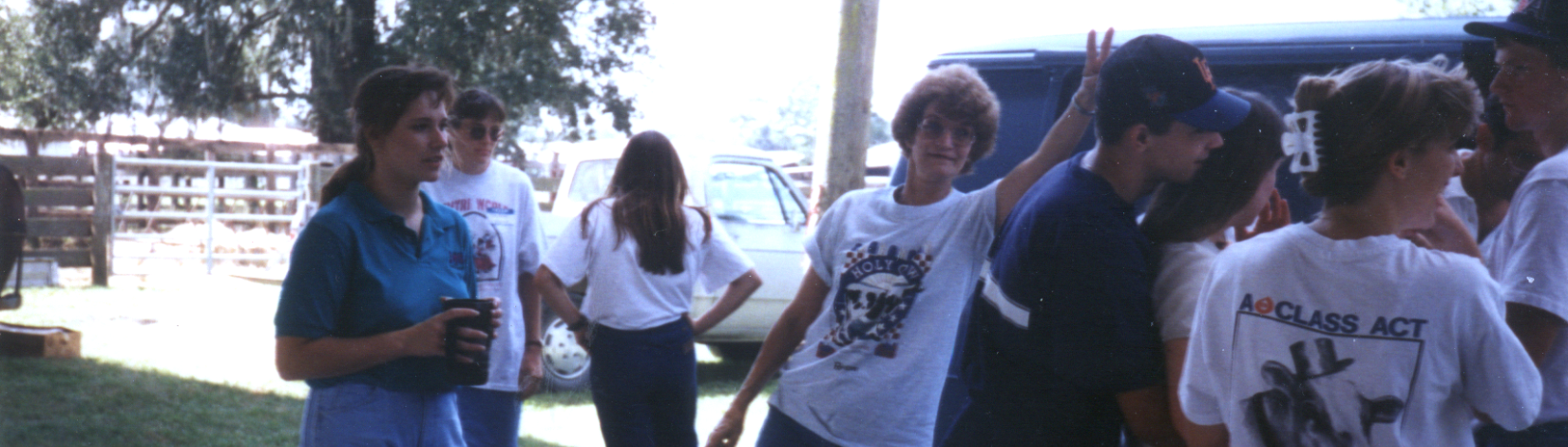 A group is gathered for an event. Joyce Hayen poses in the middle, while Dr. Deanne Meyer looks on.