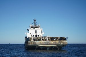 Stern view of R/V Deep Stim III - seismic research vessel. Many layer-cake artificial reef modules are on the back deck.