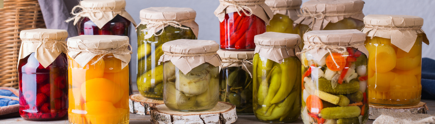 A group of vegetables preserved in jars.