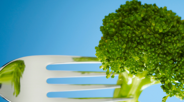 image of a piece of broccoli on a fork.