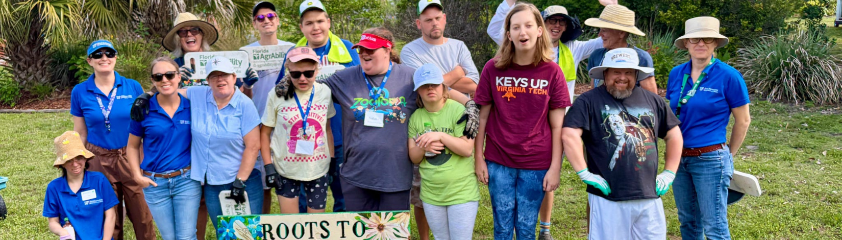 group of people surrounding gardening plot