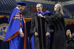 Image of Jim Hines receiving an honorary degree.