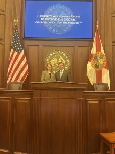 Student and Senator in the Florida Senate chamber