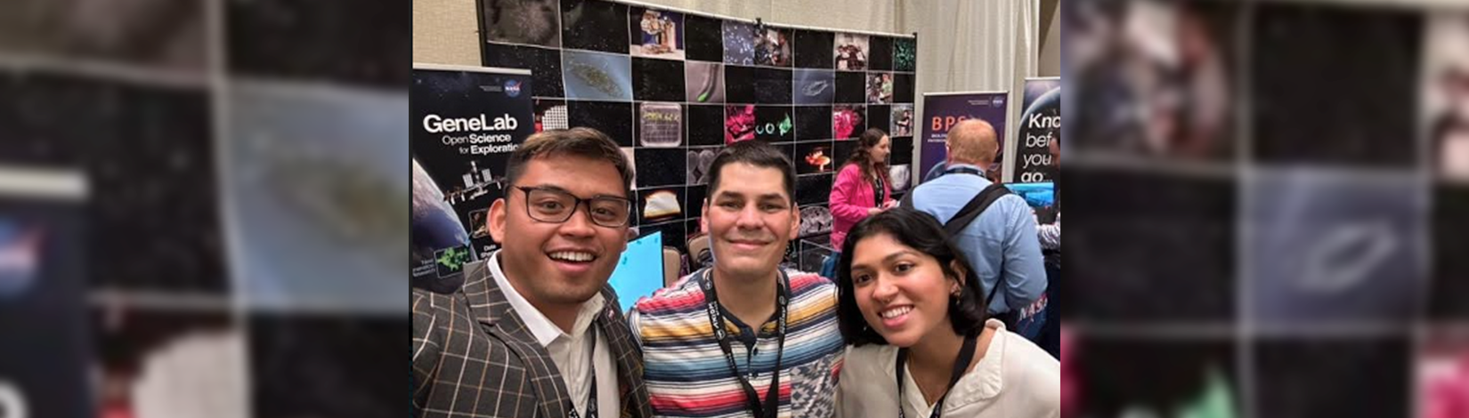 Gandhi posing with her old bosses from Kennedy Space Center.