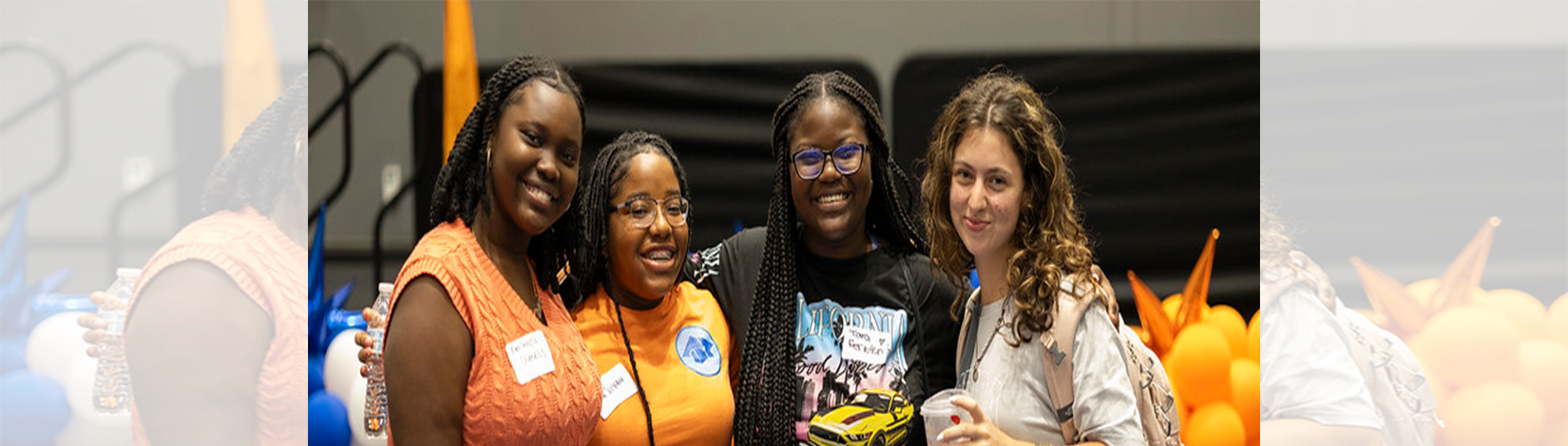 Four students posing for a group photo at a previous CALS Kickoff.