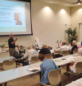 a man teaches a class of adults