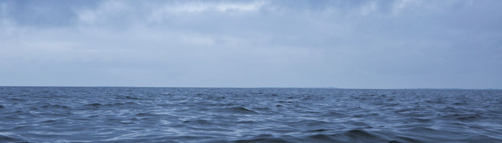 Ocean, horizon, and clouds over the Gulf of Mexico.