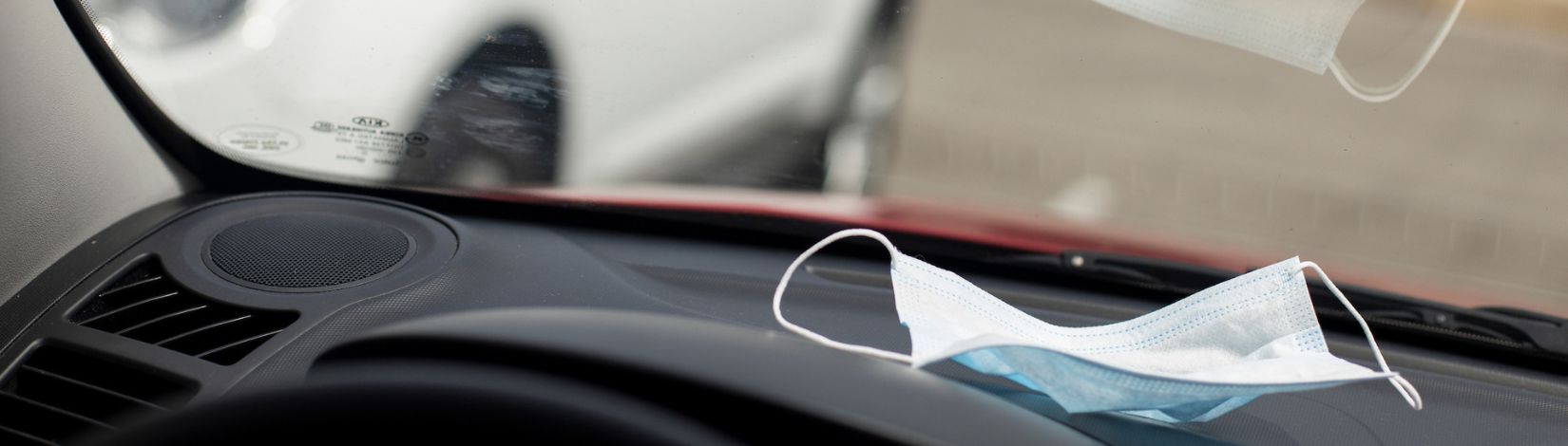 Surgical facemask in a car.