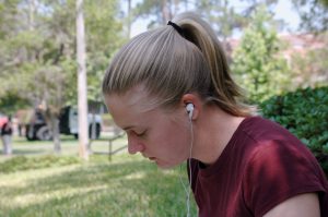 Student listening to a CALS podscast on an ipod while studying homework. UF/IFAS Photo: Sally Lanigan.