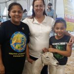 Two 4-H girls with their award winning goat