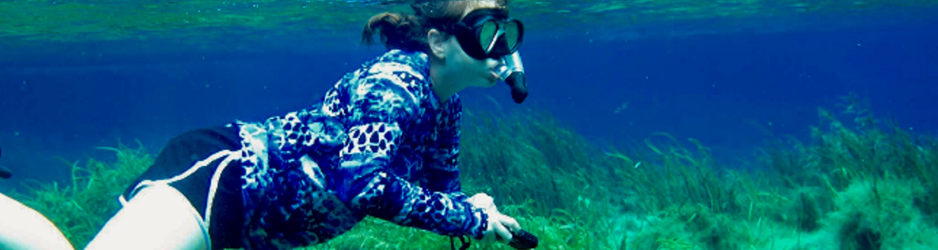 Intern Kelly Colvin snorkeling in seagrass