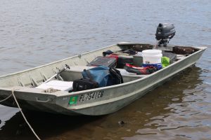 A boat with oyster reef sampling gear inside