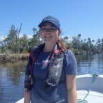 Intern Kelly Colvin on a boat