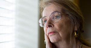 Mary Sue Koeppel gazing out a window. Photo taken 08-13-15. UF/IFAS Photo by Tyler Jones.