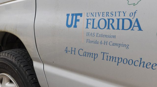UF/IFAS Extension Florida 4-H logos on side of company vehicle.