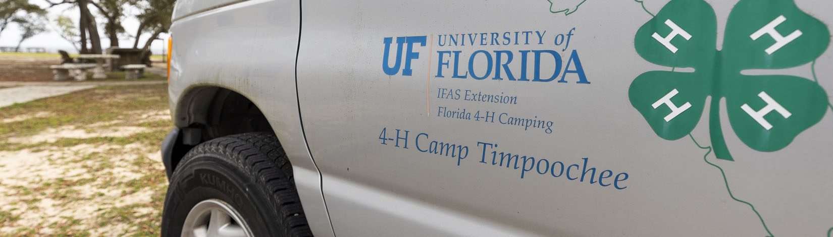 UF/IFAS Extension Florida 4-H logos on side of company vehicle.