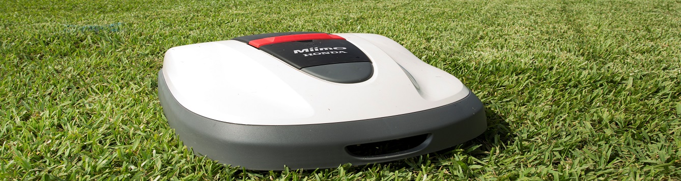 a robotic mower in a field.
