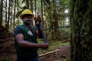 Terry Baker in forest wearing hard hat