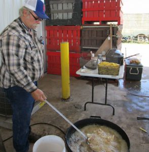 man cooking french fries