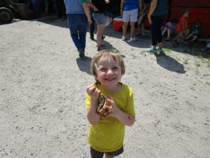 Excited participant in yellow shirt