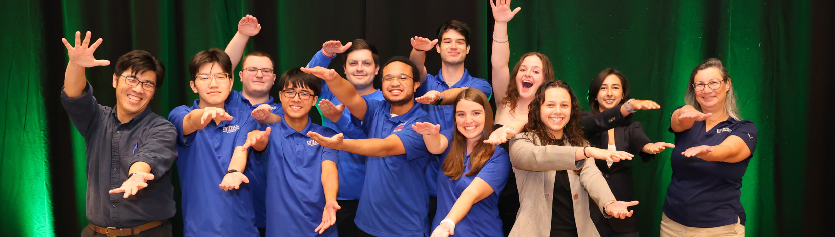 FRE Quiz Bowl and other students post doing the Gator Chomp at AAEA 2025