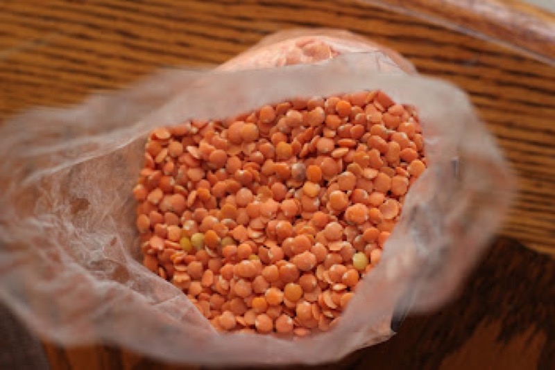 Red lentils in a clear bag.