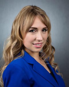 Dr. Larua Acosta headshot wearing a blue jacket, dietetics | Food Science and Human Nutrition UF/IFAS
