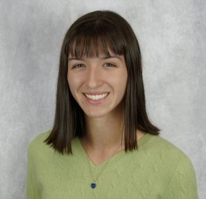 Emma wearing a green shirt in front of a light gray background, sensor | Food Science and Human Nutrition UF/IFAS