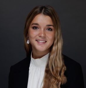 Josefina wears a white shirt and black jacket against a dark background, ARFID | Food Science and Human Nutrition UF/IFAS