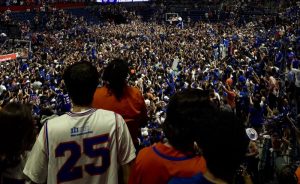 A large crowd at a basketball game.