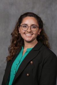 Melissa headshot wearing dark jacket and glasses, facial pain | Food Science and Human Nutrition UF/IFAS
