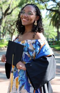 Rachel wearing graduation gear outside with trees in the background, advice | Food Science and Human Nutrition UF/IFAS