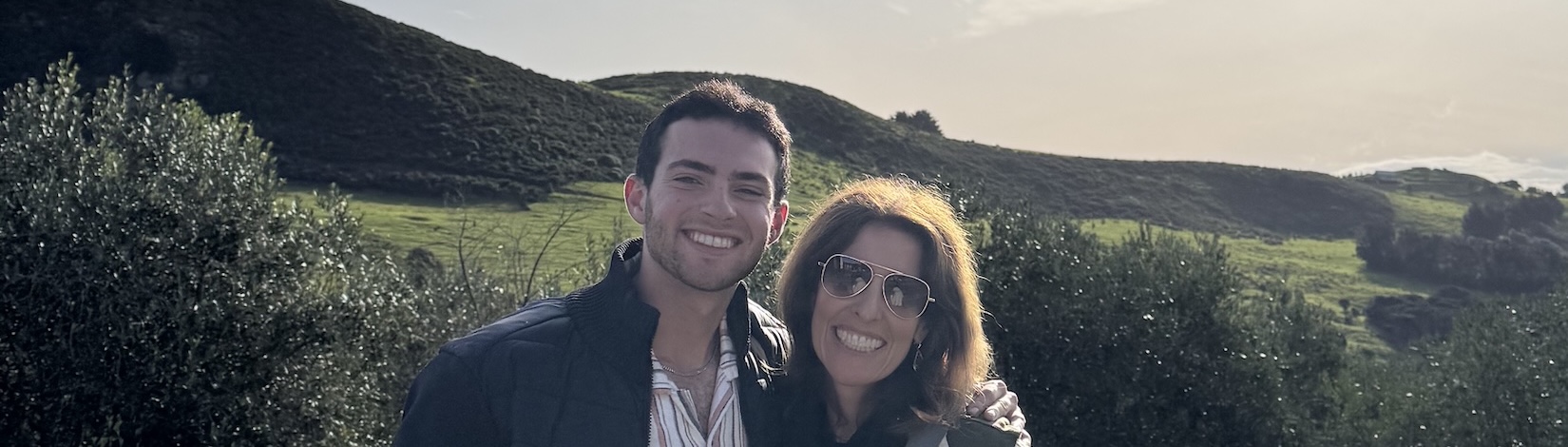 Zachary and his mother at a vineyard.