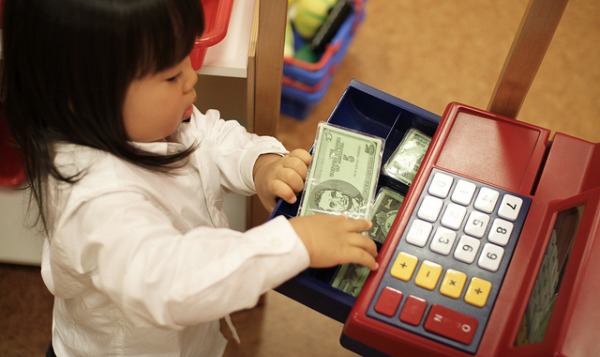 child at cash register